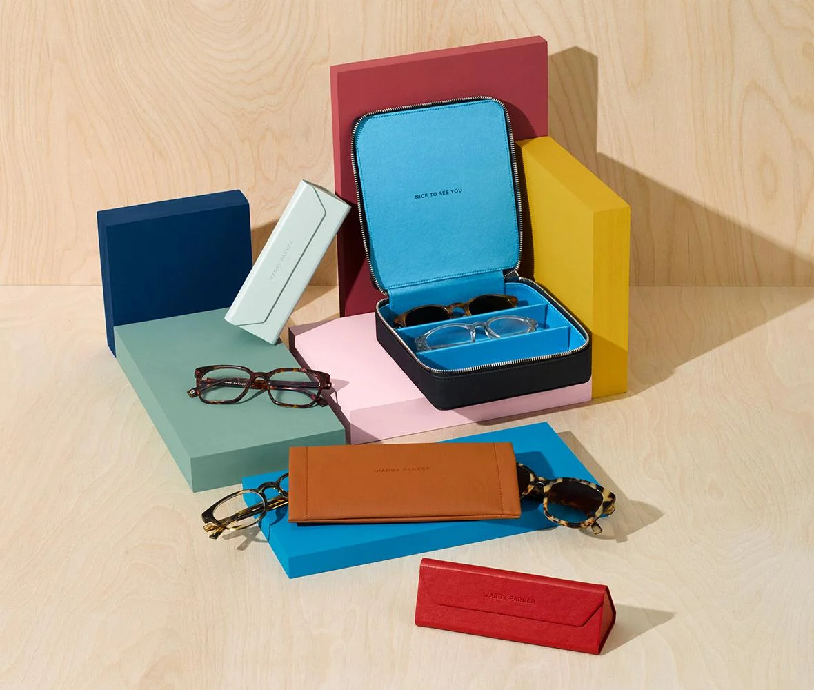 A variety of glasses on colorful boxes and cases