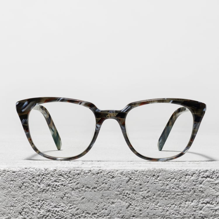 Glasses frames sitting on a concrete block