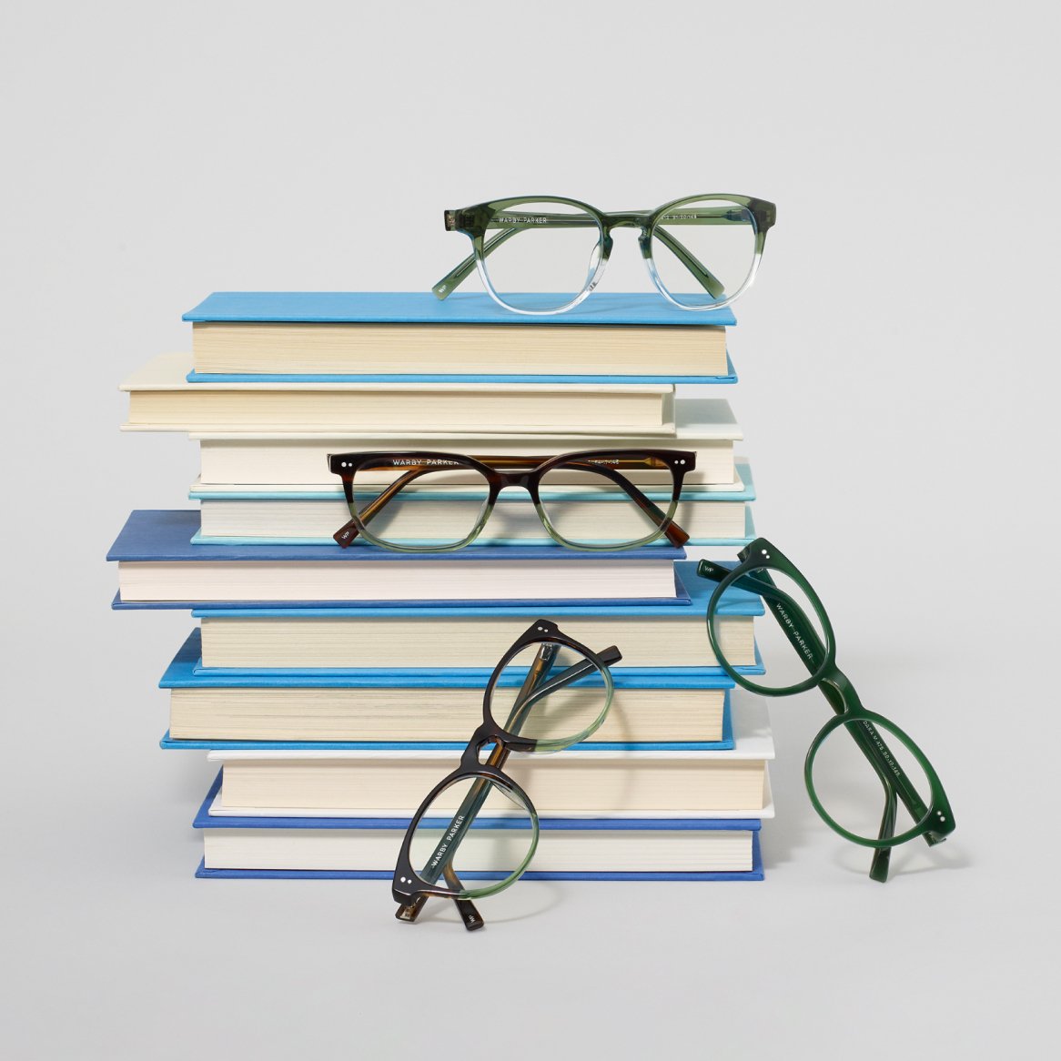 Glasses frames with stack of books