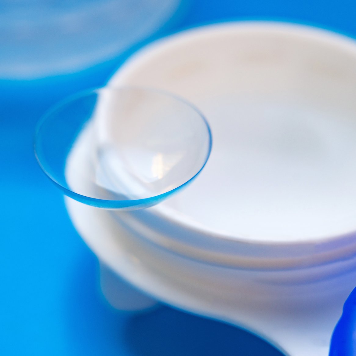 Close-up image of a contact lens placed on a storage case