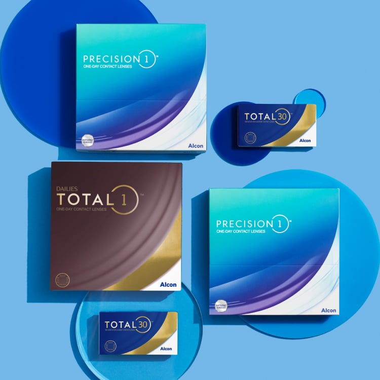 Five boxes of contact lenses from different brands arrayed on a blue background