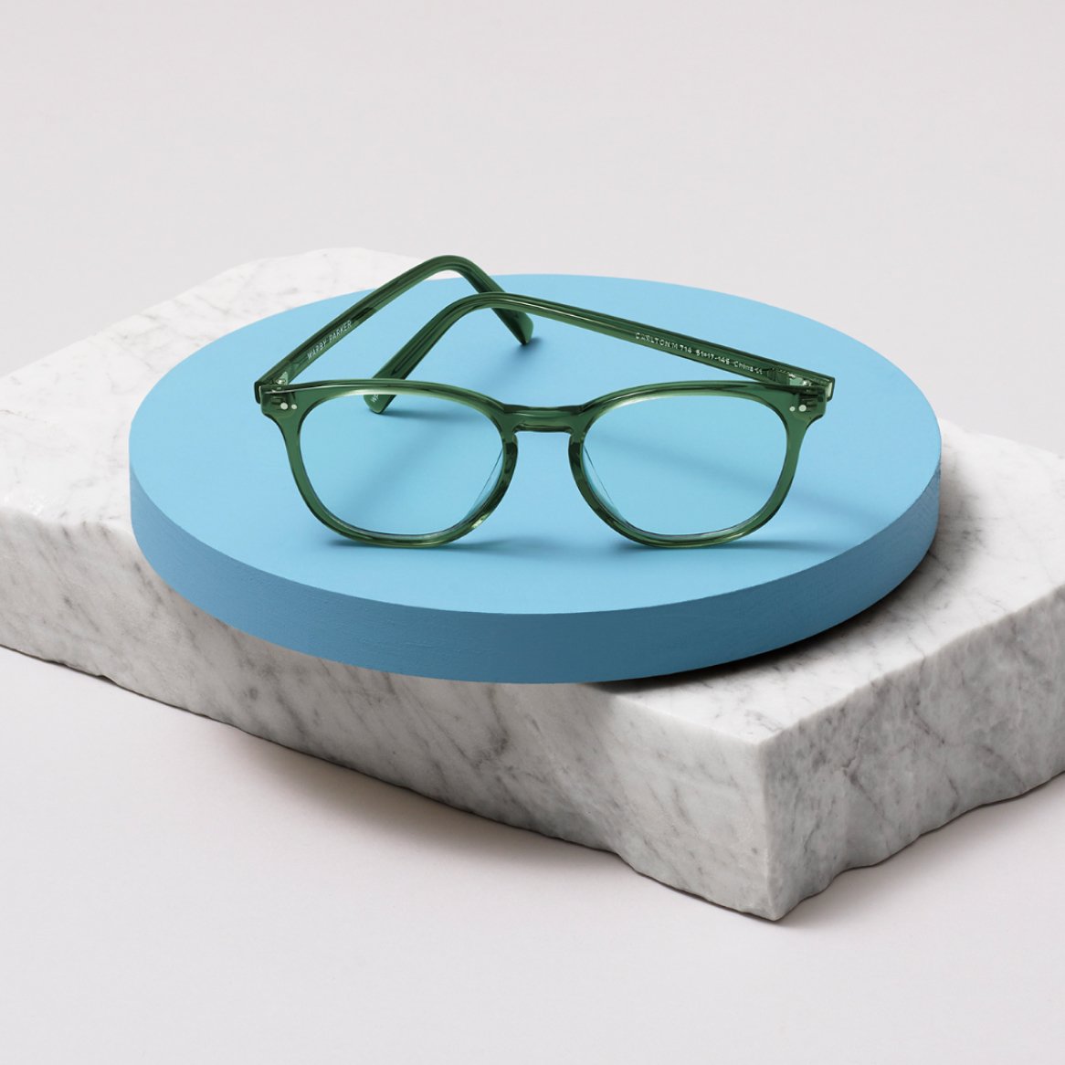 A pair of new glasses displayed on a block