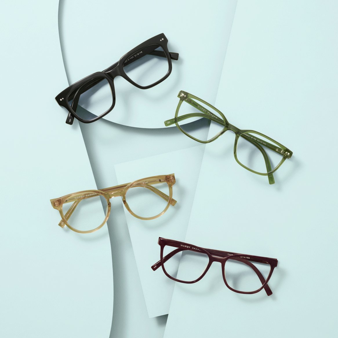Four pairs of eyeglasses in different colors