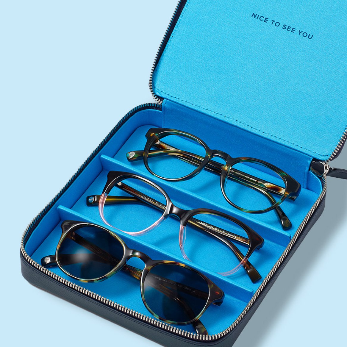 A travel case for sunglasses with room for three pairs of glasses.