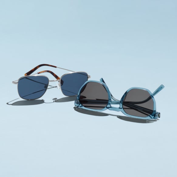 How to choose sunglasses - two pairs of sunglasses on blue background.